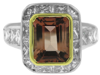 18kt white gold bezel set emerald cut tourmaline and princess cut diamond ring