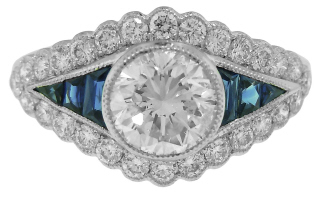 Platinum round diamond and calibre sapphire engagement ring