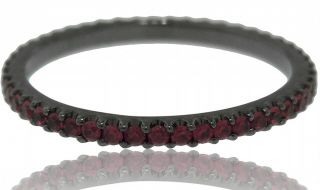 18kt white gold ruby eternity band with black rhodium.