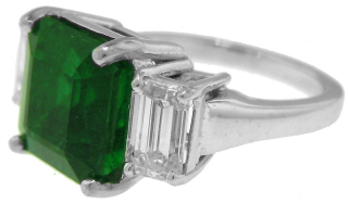 Platinum emerald cut emerald and diamond ring