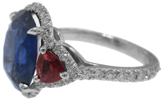 Platinum ring with oval sapphire 4.39cts, diamonds and rubies