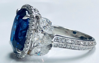 Platinum oval sapphire and diamond halo ring