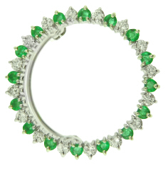 Platinum emerald and diamond circle pin.