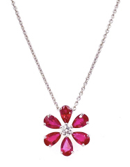 18kt white gold ruby and diamond flower style pendant with chain.