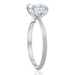 Platinum emerald cut diamond solitaire engagement ring