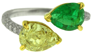 Platinum and 18kt yellow gold pear shape emerald and pear shape yellow diamond ring