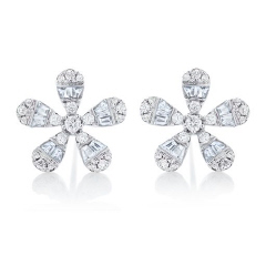 14kt white gold petite round and baguette diamond flower stud earrings.