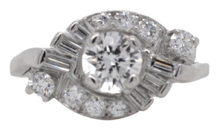 Platinum round and baguette diamond ring