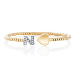 18kt yellow gold cuff bangle bracelet with diamond "N" initial and puff heart ends.