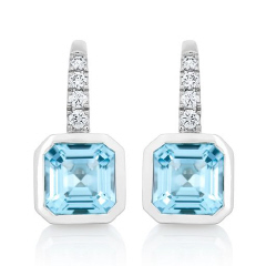 14kt white gold bezel set blue topaz and diamond earrings