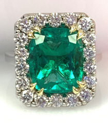 18kt white gold cushion emerald and diamond ring.