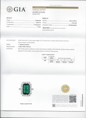 Platinum emerald cut emerald and diamond halo ring