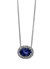 18kt white gold oval sapphire and diamond halo pendant with chain.