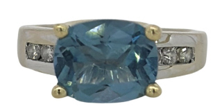 14kt two tone blue topaz and diamond ring.