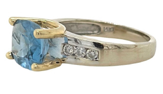 14kt two tone blue topaz and diamond ring.