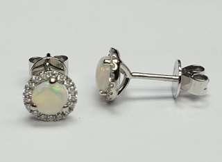 18kt white gold opal and diamond halo stud earrings.
