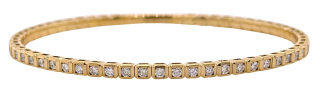 14kt yellow gold flexible diamond bangle bracelet.
