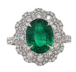 18kt white gold oval emerald and diamond ring.