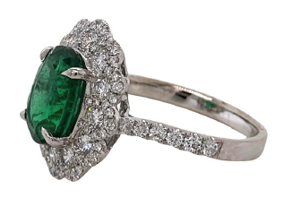 18kt white gold oval emerald and diamond ring.