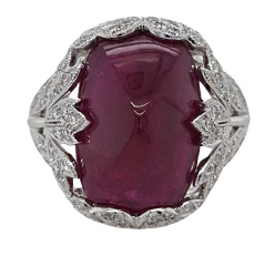Platinum cushion sugarloaf cabachon ruby and diamond ring.