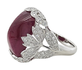 Platinum cushion sugarloaf cabachon ruby and diamond ring.