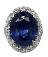 18kt white gold oval sapphire and pave diamond ring.