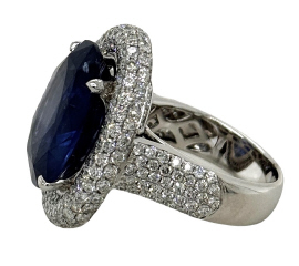 18kt white gold oval sapphire and pave diamond ring.