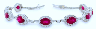 18kt white gold oval ruby and diamond bracelet.