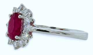 18kt white gold oval ruby and diamond halo ring