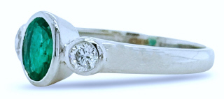 18kt white gold bezel set emerald and diamond 3 stone ring