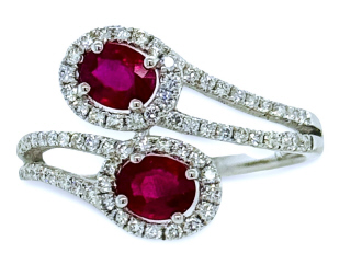 18kt white gold ruby and diamond cross over ring.