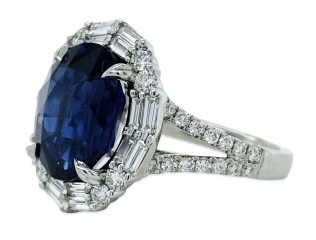 18kt white gold oval sapphire with round and baguette diamond split shank ring