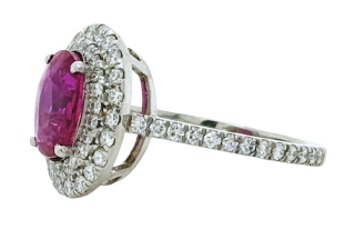 Platinum ruby and diamond halo ring