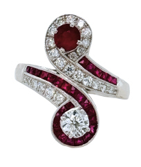 18kt white gold ruby and diamond bypass style ring.