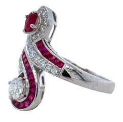 18kt white gold ruby and diamond bypass style ring.