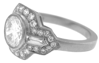 Platinum round and baguette diamond ring