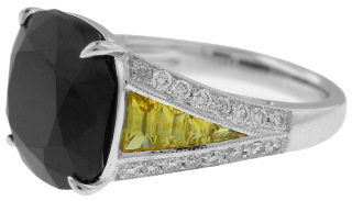 Platinum ring with cushion sapphire, diamonds, and yellow sapphires