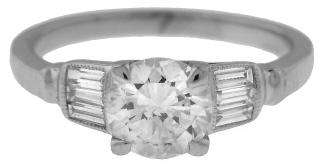 Platinum round and baguette diamond ring.