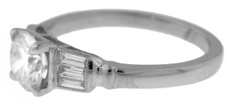 Platinum round and baguette diamond ring.