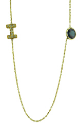 14kt yellow gold bezel set sapphire and diamond "I" necklace.