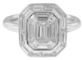 18kt white gold emerald cut and baguette diamond illusion ring.