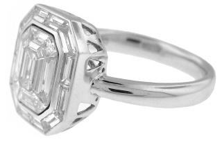 18kt white gold invisible set baguette and emerald cut diamond ring.
