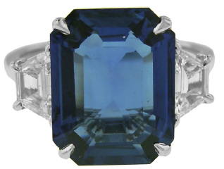 Platinum emerald cut sapphire and trapezoid diamond ring