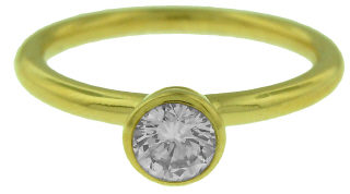 18kt yellow gold bezel set diamond ring.
