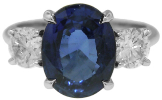 Platinum oval sapphire and round diamond ring