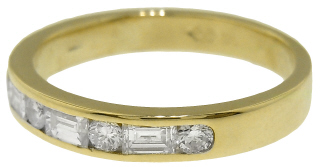 14kt yellow gold round and baguette diamond channel set half around band