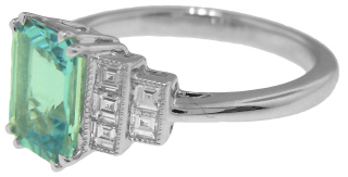 Platinum emerald cut aqua and square diamond ring.