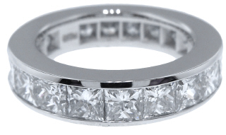 Platinum channel set princess cut diamond eternity band