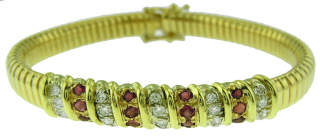 14kt yellow gold flexible diamond and ruby bangle bracelet