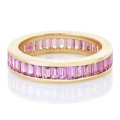 14kt yellow gold channel set baguette pink sapphire eternity band.